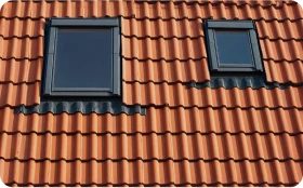 Instalación de Claraboyas 6 Tejados Alcala Henares tiled roof against blue sky with clouds idea background with space text ecofriendly traditional roofs home 3 14 - Tejados Alcala Henares